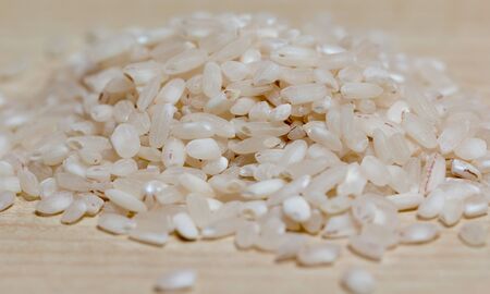 rice on a wooden backgroundの写真素材