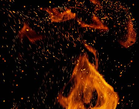 Flame of fire with sparks on a black background