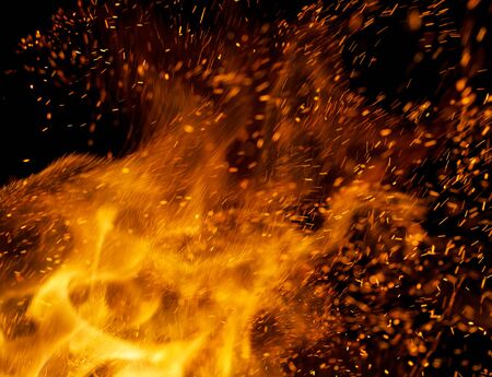 flame of fire with sparks on a black background