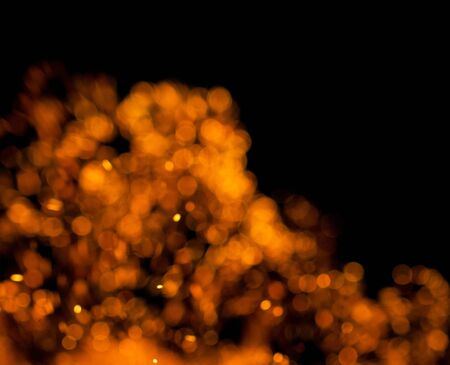 flame of fire with sparks on a black backgroundの写真素材