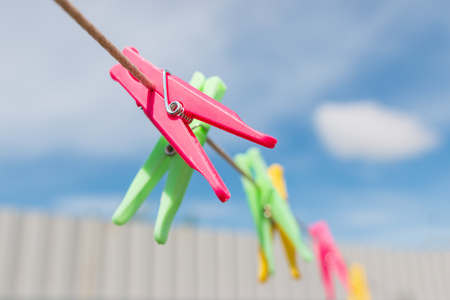 clothes pegs on the ropeの写真素材