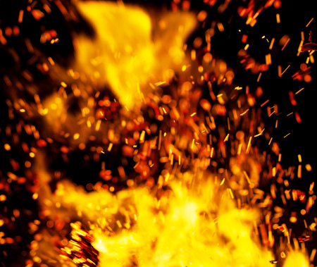 flame of fire with sparks on a black background