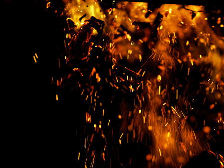 flame of fire with sparks on a black background