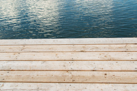 Wooden planks on the background of water