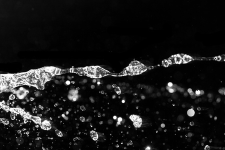 Splashes inlets on a black backgroundの写真素材