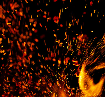 Flame of fire with sparks on a black background