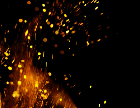 flame of fire with sparks on a black background