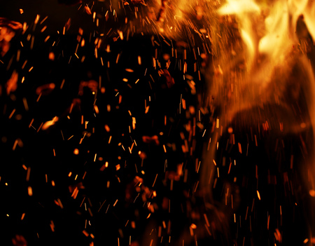 flame of fire with sparks on a black background