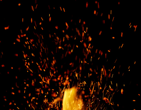 flame of fire with sparks on a black background