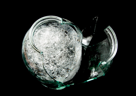 ice under the cracked glass on a black backgroundの写真素材
