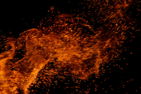 flame of fire with sparks on a black background