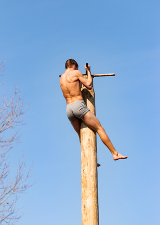 man on a wooden post, sportの写真素材