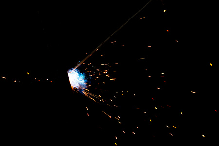 flash of light with sparks on a black background