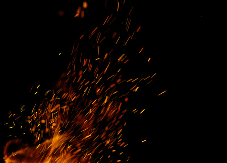 flame of fire with sparks on a black backgroundの写真素材