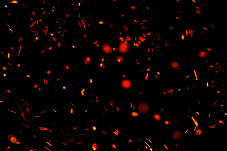 flame of fire with sparks black backgroundの写真素材