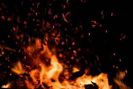 flame of fire with sparks on a black background