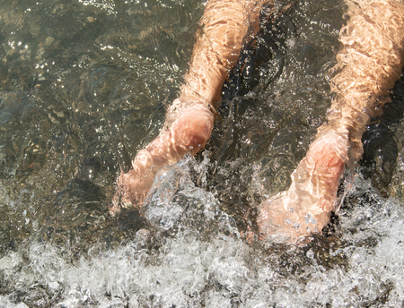 feet in the waterの写真素材