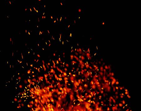 flame of fire with sparks on a black backgroundの写真素材