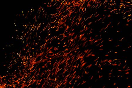 flame of fire with sparks on a black backgroundの写真素材