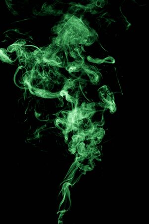 green smoke on black backgroundの写真素材
