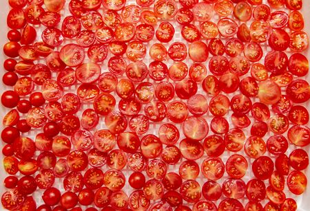 fresh cherry tomatoes on a white backgroundの写真素材