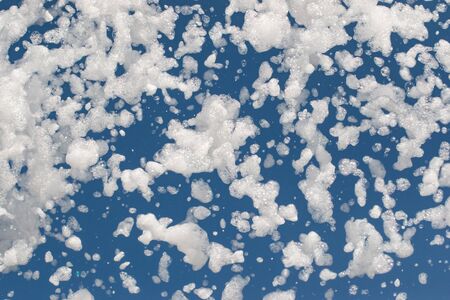 white foam on a blue backgroundの写真素材