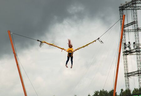 child on a ride jumps in height