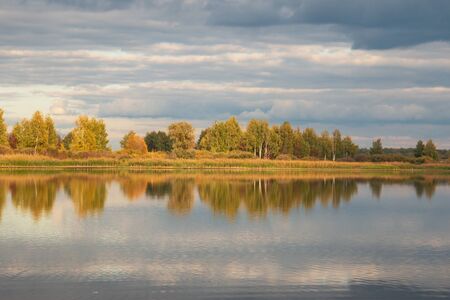 autumn landscape with trees with reflectionの写真素材