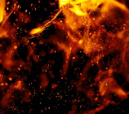 flame of fire with sparks on a black background