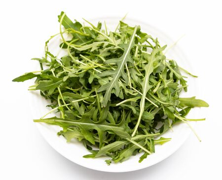 leaves of arugula on white backgroundの写真素材