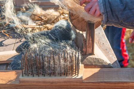 ancient wool comb for clothesの写真素材