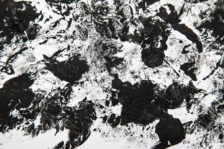 strokes of black paint on a white background as an abstract background
