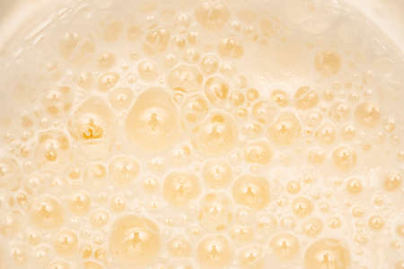 lush beer foam as backgroundの写真素材