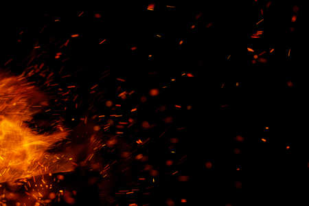 flame of fire with sparks on a black background