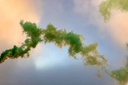 green smoke against the sky