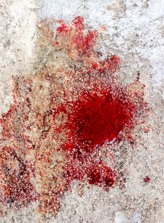 blood stains on white snow as backgroundの写真素材