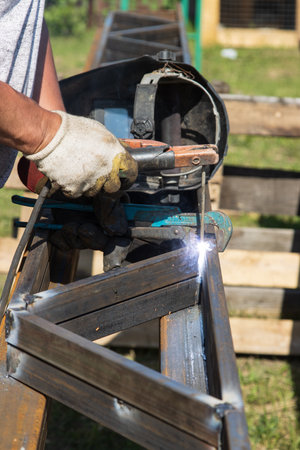 man works with metal at work
