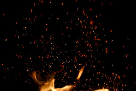 flame of fire with sparks on a black background