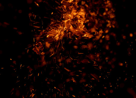 fire flame with sparks on black backgroundの写真素材