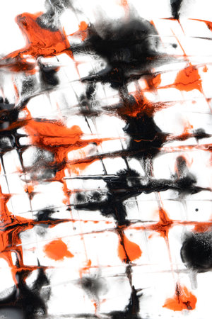 black and red drops of paint with stains on a white backgroundの写真素材