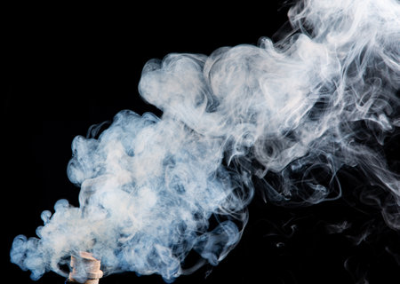 white smoke on black backgroundの写真素材