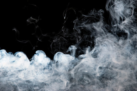 gray smoke with a blue tint on a black background