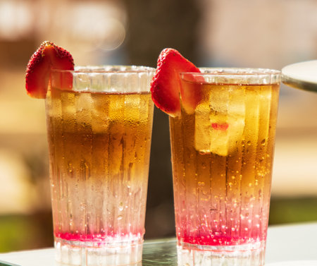 cold fruit cocktail on sunburst backgroundの写真素材
