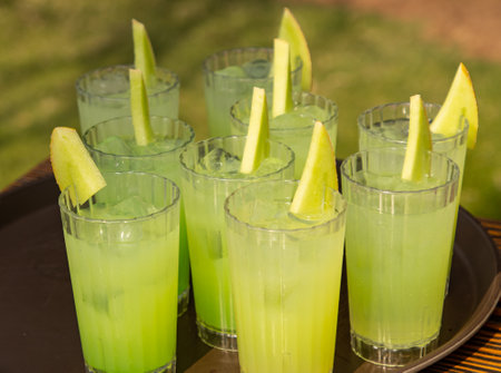 cold cocktail with fruits as backgroundの写真素材