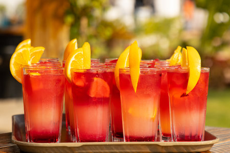 cold cocktail with fruits as backgroundの写真素材