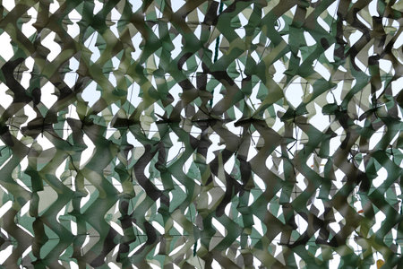 khaki material with holes like itの写真素材