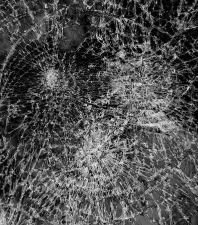 shattered glass with small shards as a background.の写真素材