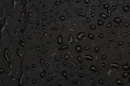 drops of water from the rain on a black background