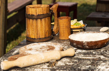 wooden board and rolling pin with flour for making doughの写真素材