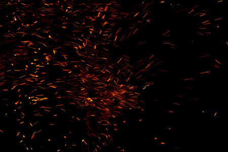 fire flame with sparks on black backgroundの写真素材